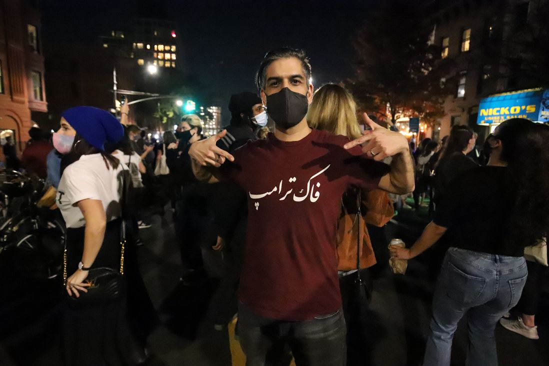 This shirt reads "F*ck Trump" in Farsi